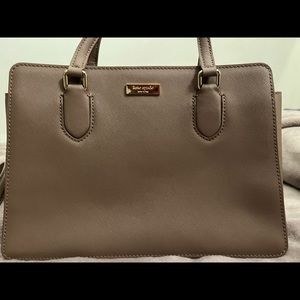 Kate spade three pocket hand bag. Worn 2x brownish color .